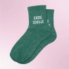 Chaussettes vertes à paillettes avec inscription "Casse couille"