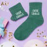 Chaussettes vertes à paillettes avec inscription "Casse couille"