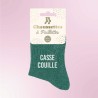 Chaussettes vertes à paillettes avec inscription "Casse couille"